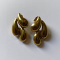 Pair of gold earrings on a white background