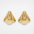 Pair of gold cone-shaped earrings on a light gray background