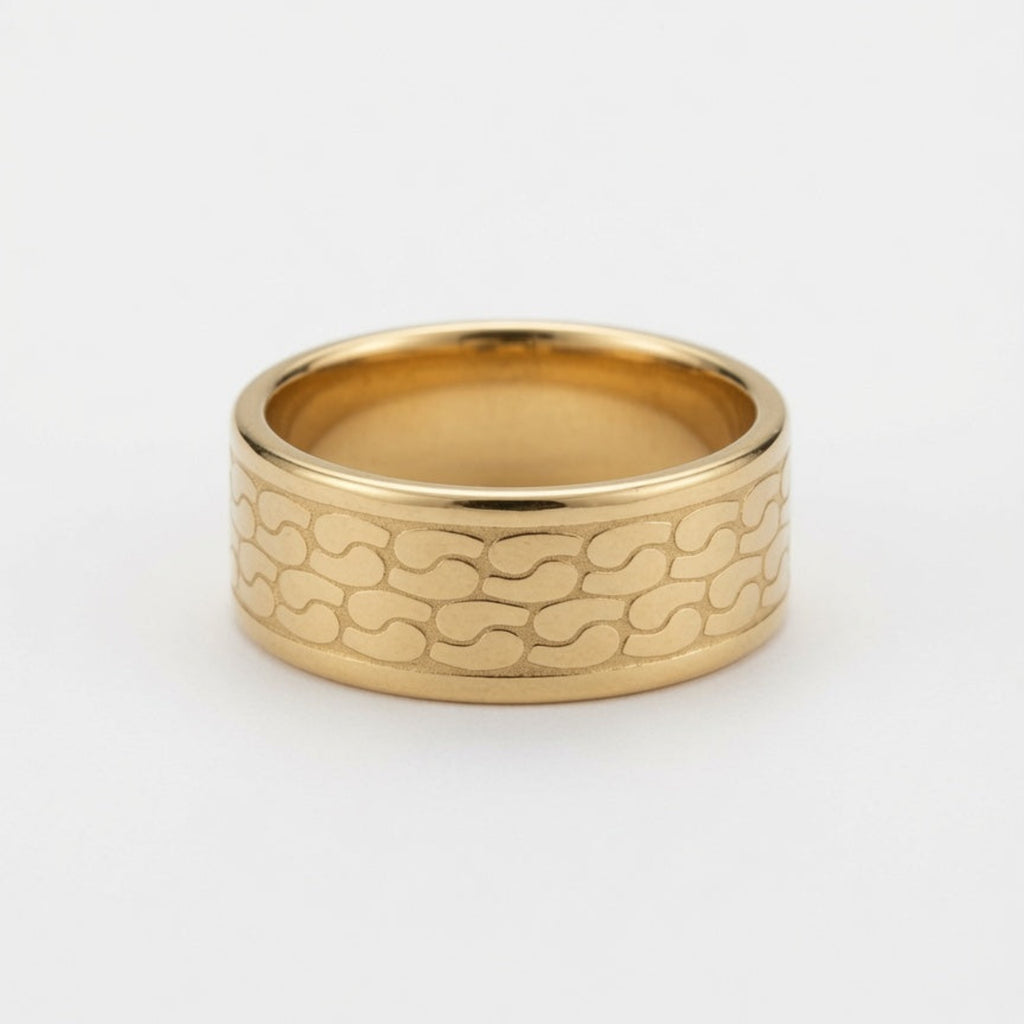 A wide gold band ring with a textured, wavy interlocking pattern on the outer surface, photographed on a clean white background.