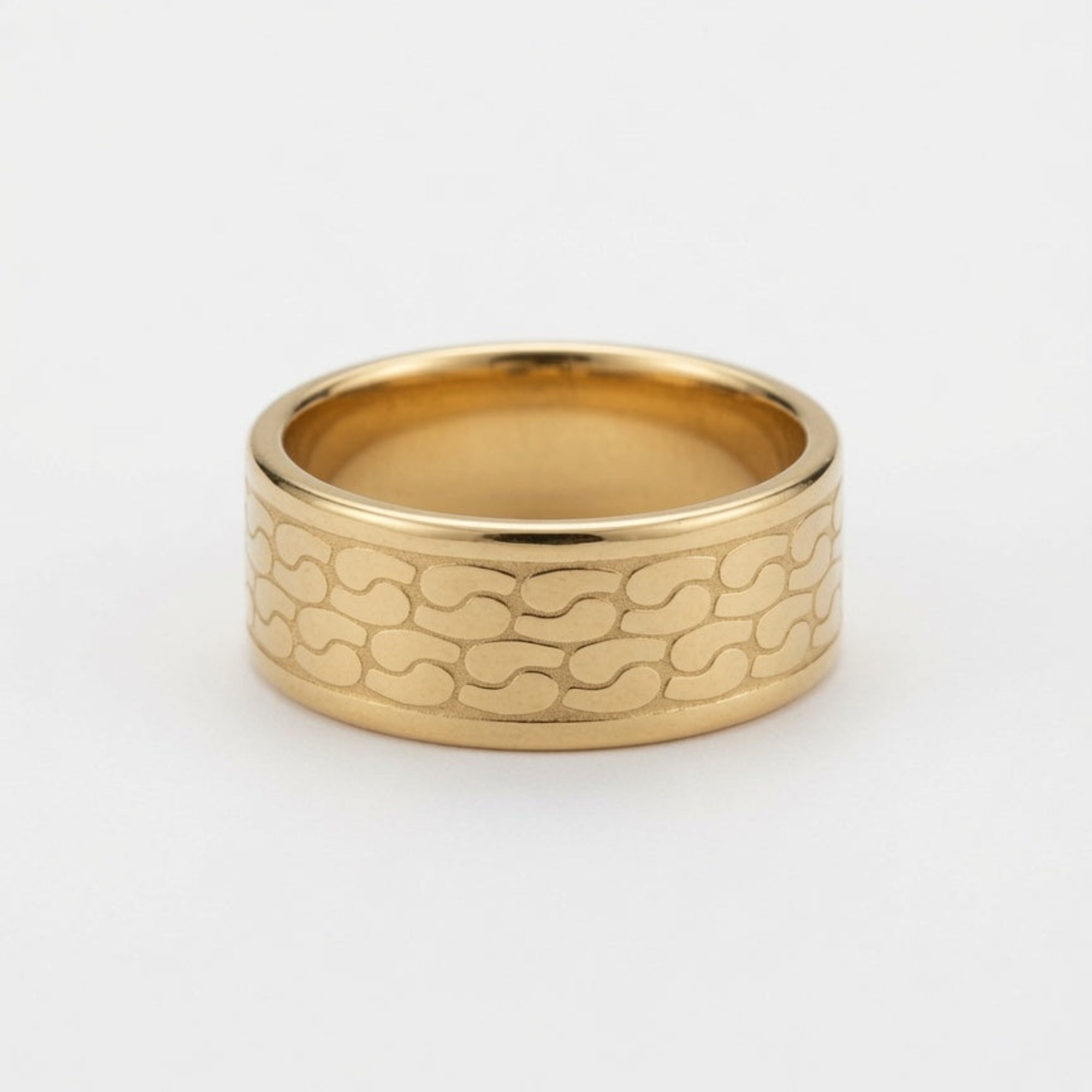 A wide gold band ring with a textured, wavy interlocking pattern on the outer surface, photographed on a clean white background.