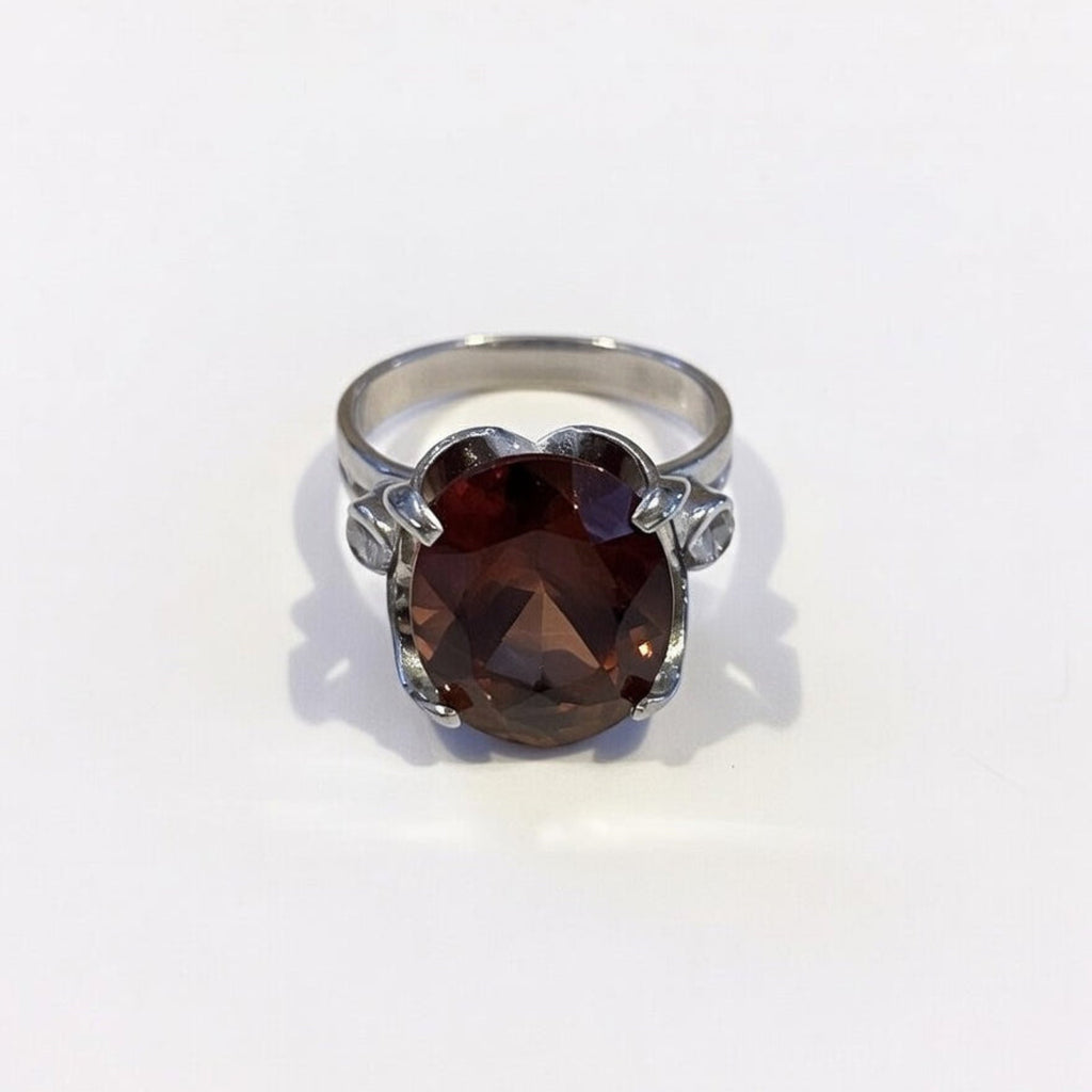 Silver ring with a large brown pink gemstone boheme london