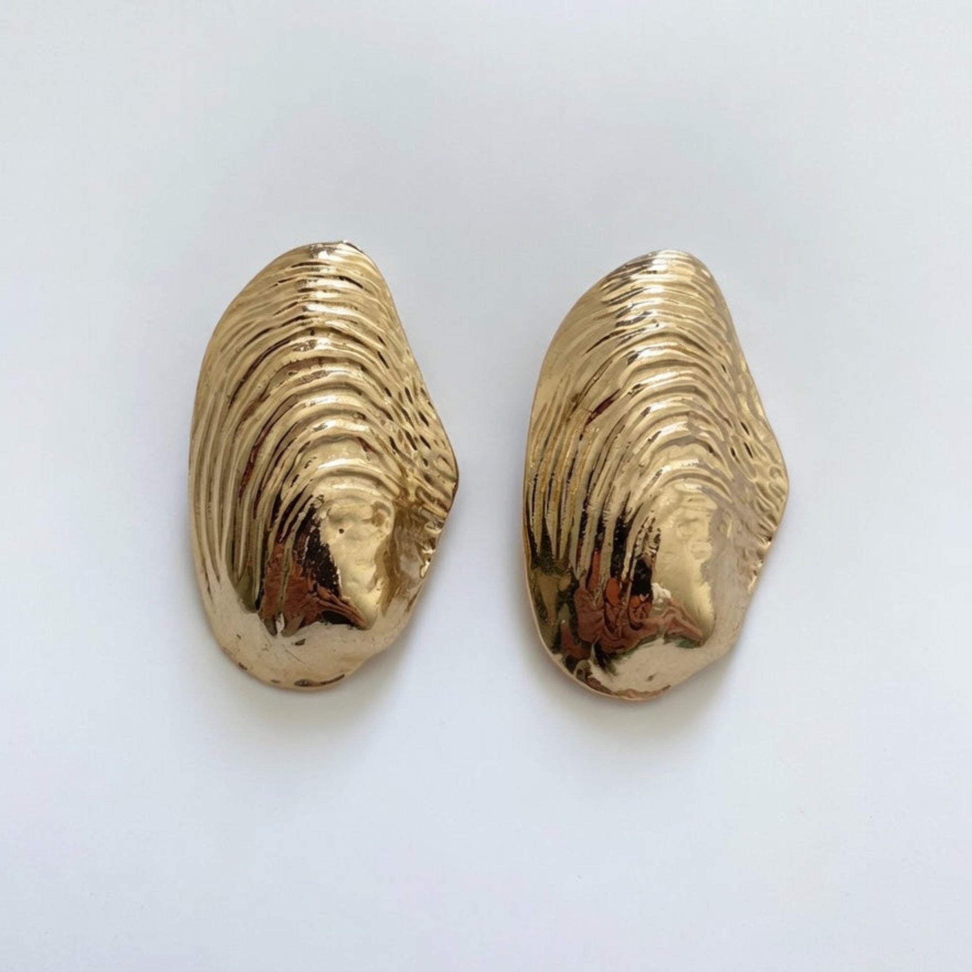 gold shell earrings for a statement and holiday wear boheme london