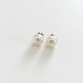 Pair of pearl earrings on a white background, boheme london, freshwater pearl